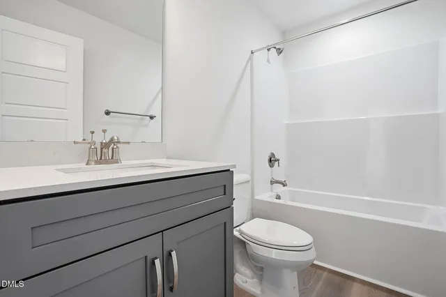 a bathroom with a sink a toilet and a bathtub