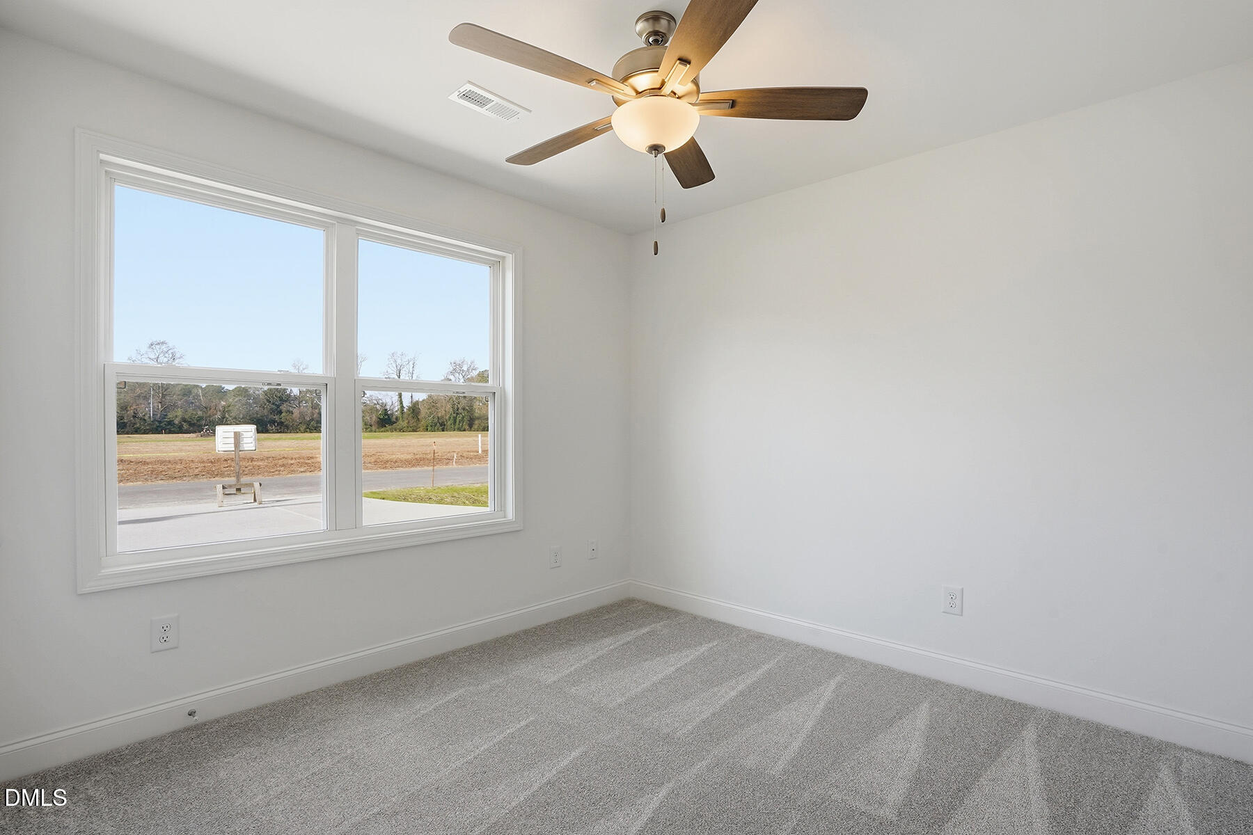218 Rae Street Warsaw, NC 28398 - Photo 25 of 31 an empty room with a window and a fan
