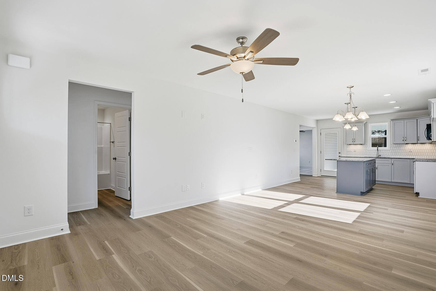 218 Rae Street Warsaw, NC 28398 - Photo 6 of 31 a view of a kitchen with wooden floor and window