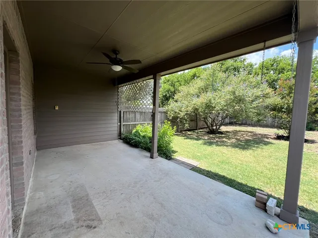 a view of a room with yard and balcony