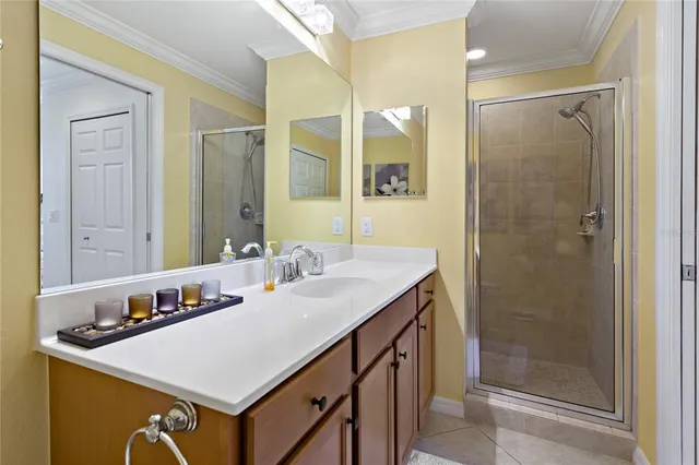 a living room with furniture a lamp paintings and a window