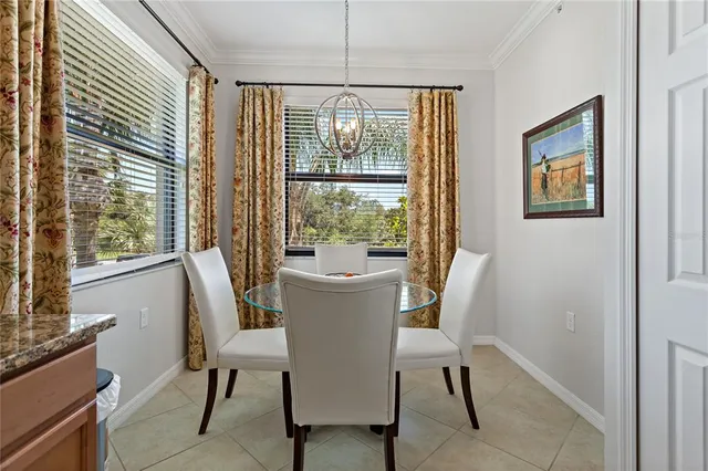 a kitchen with stainless steel appliances granite countertop a refrigerator a stove and a sink