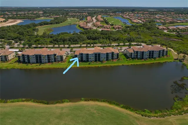 an aerial view of a residential houses with outdoor space