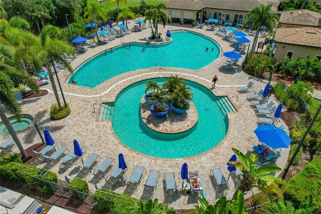 an aerial view of a pool patio patio and outdoor seating