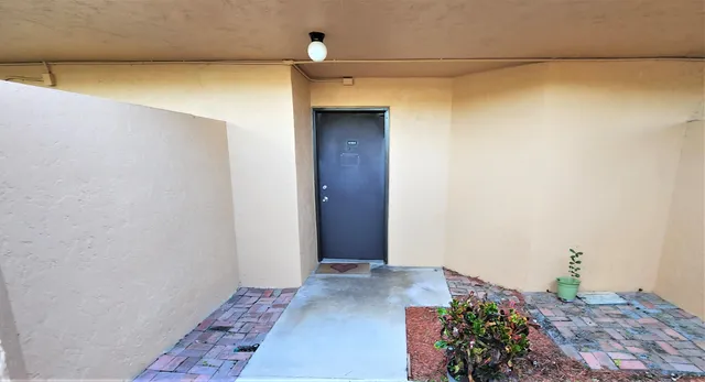 a view of living room with furniture and floor to ceiling window