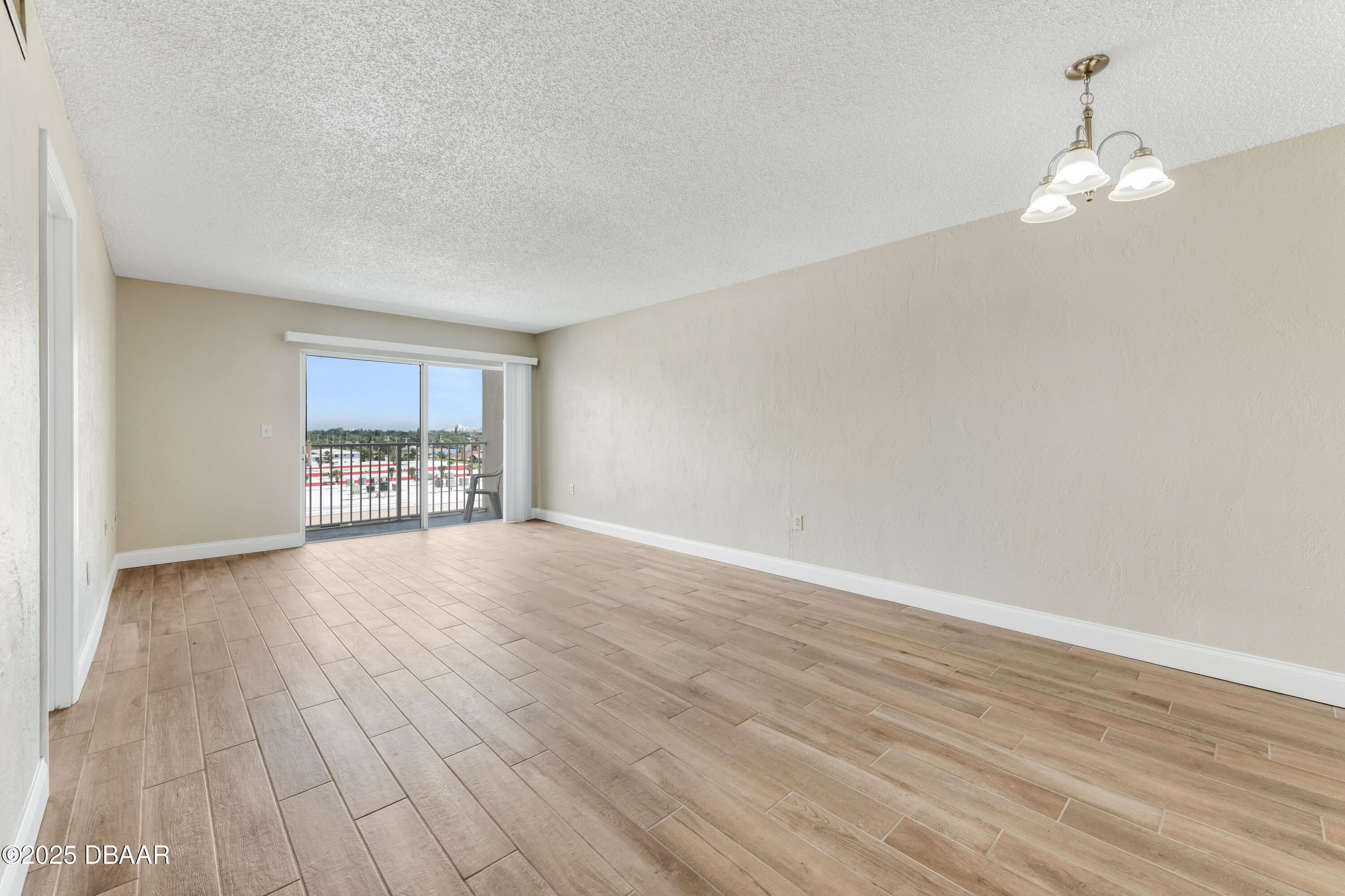 2711 North Halifax Avenue, Unit 794 Daytona Beach, FL 32118 - Photo 7 of 22 a view of empty room with wooden floor