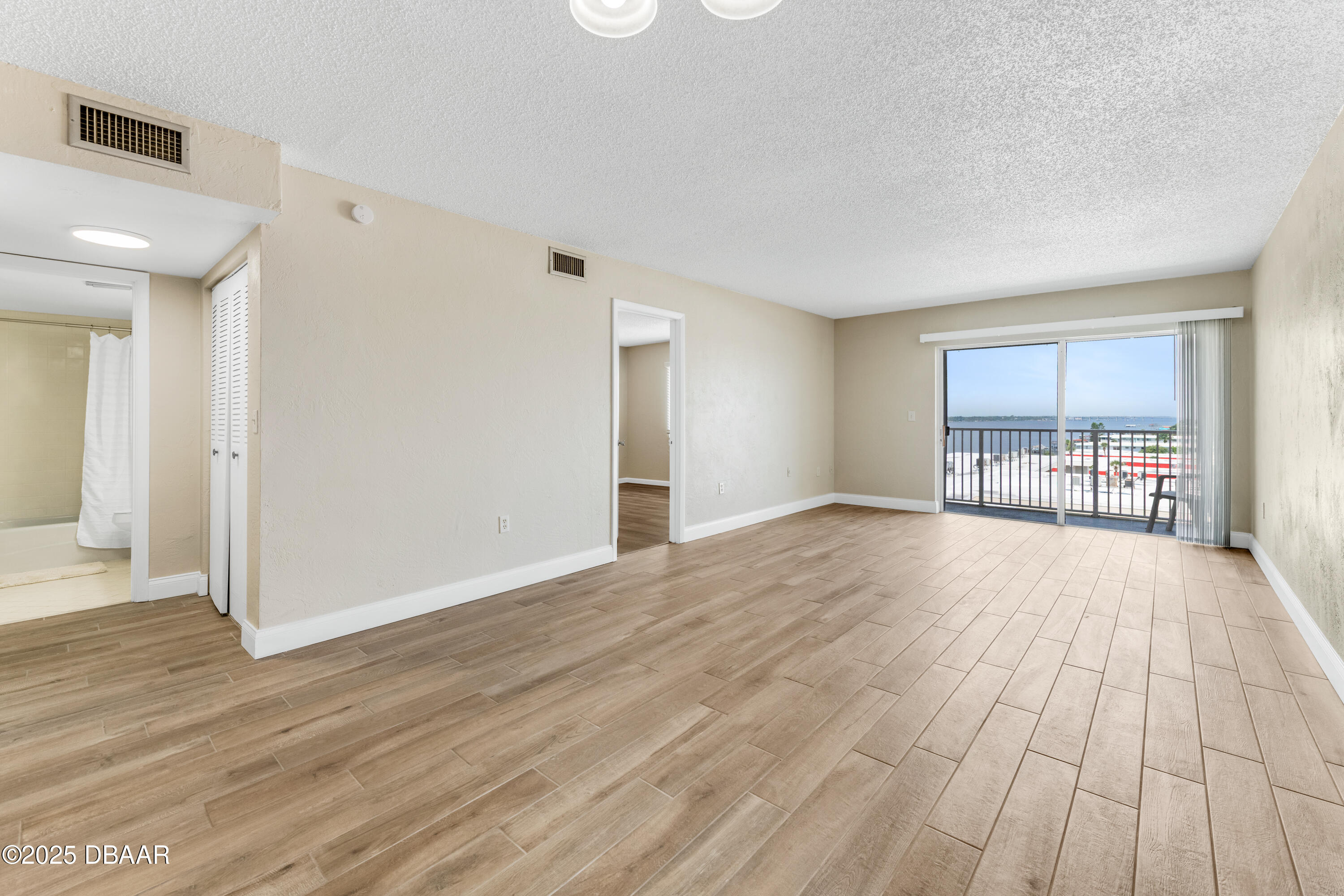 2711 North Halifax Avenue, Unit 794 Daytona Beach, FL 32118 - Photo 8 of 22 a view of empty room with wooden floor