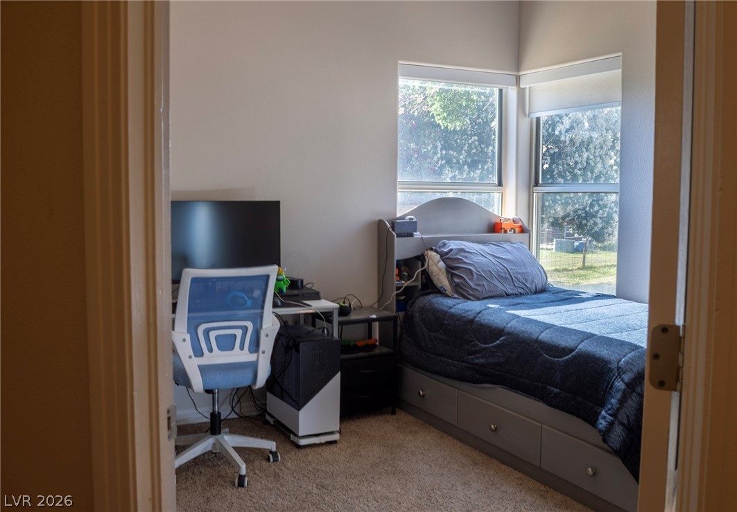 2775 Taylor Street Logandale, NV 89021 - Photo 25 of 41 This cozy bedroom features a neutral color palette and ample natural light, ideal for peaceful living.