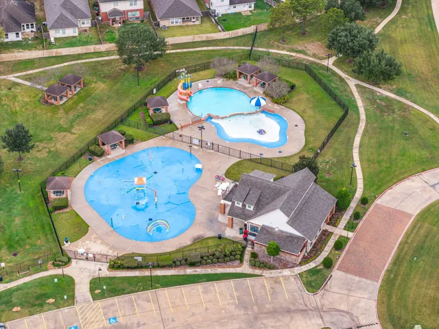 an aerial view of a dining space with lots of swings and slides