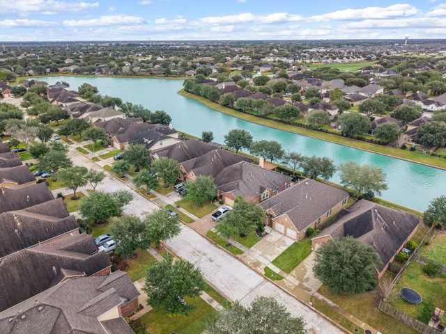an aerial view of a city with lake view