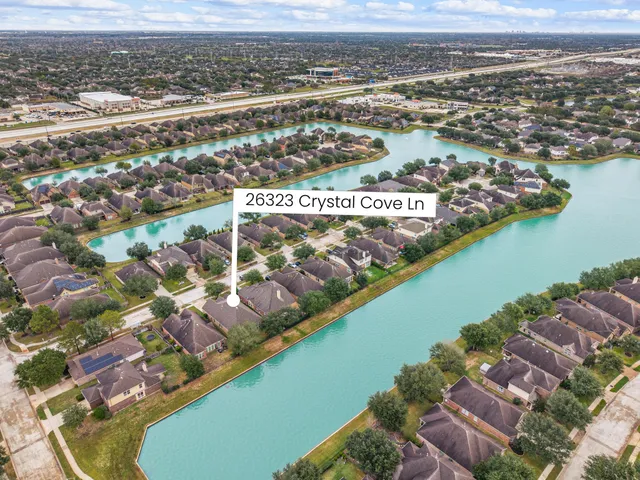 an aerial view of residential building and lake