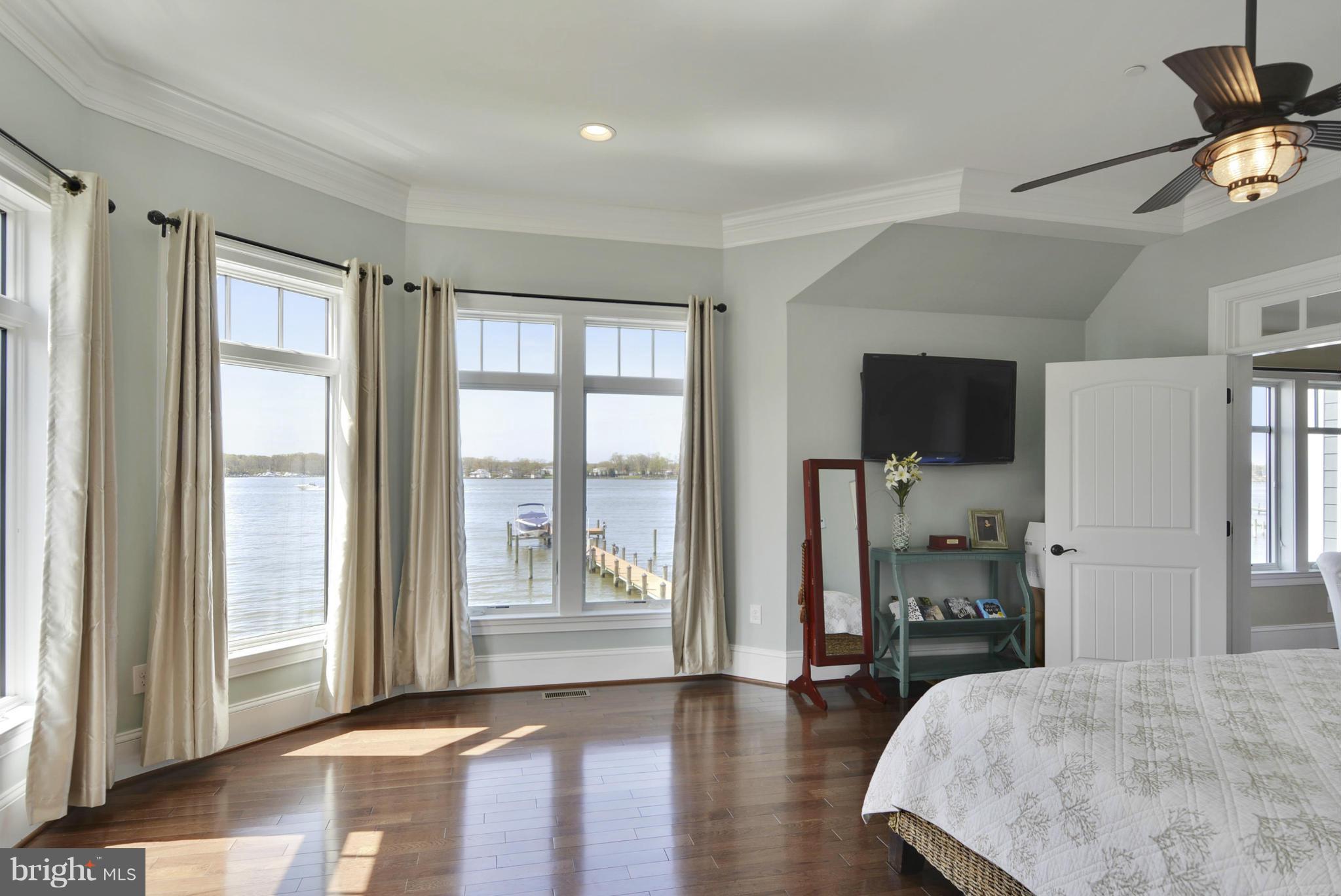 1824 Wilson Point Road Baltimore, MD 21220 - Photo 13 of 28 a view of a livingroom with wooden floor and a bedroom