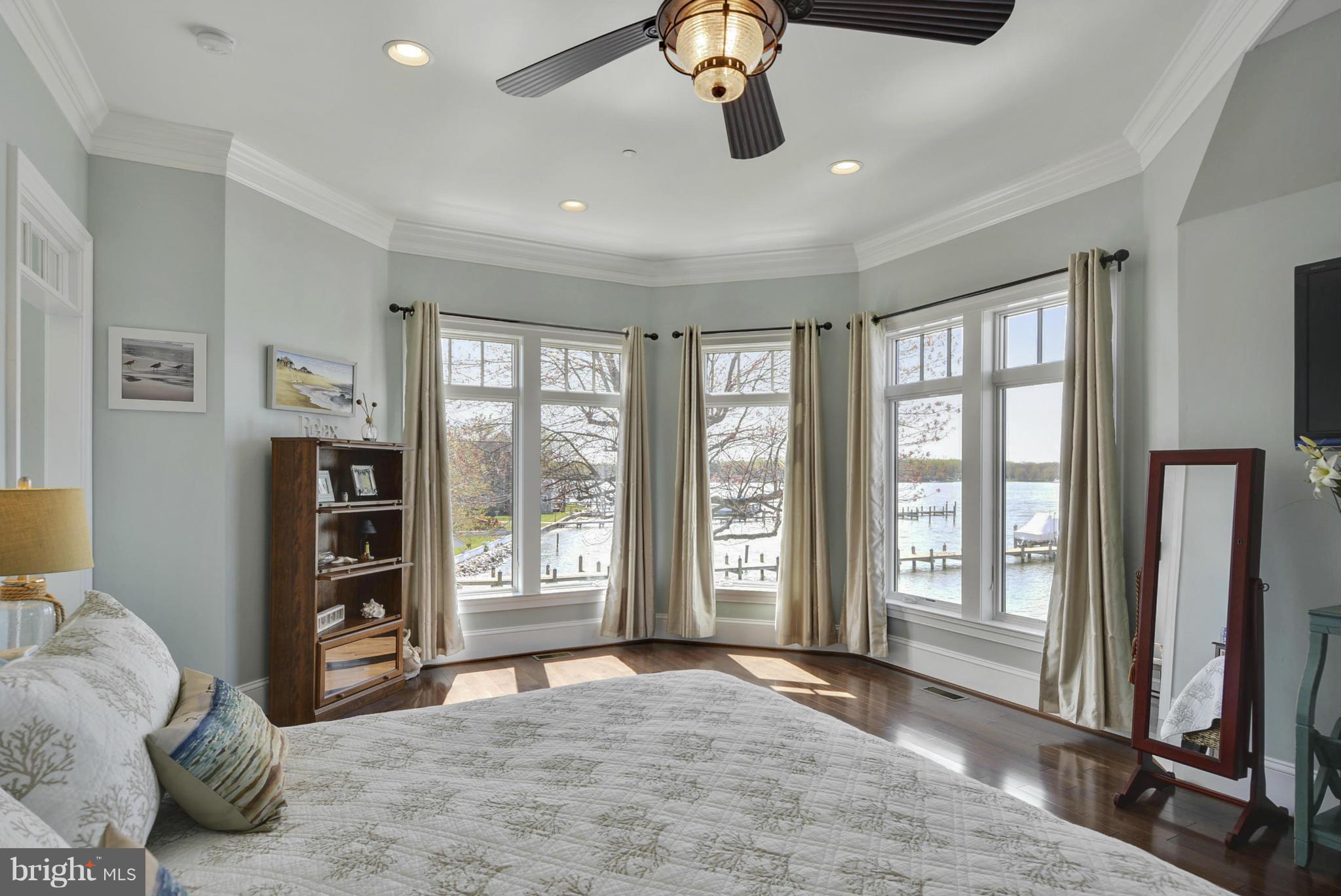 1824 Wilson Point Road Baltimore, MD 21220 - Photo 14 of 28 a view of a bedroom with large window and a bed