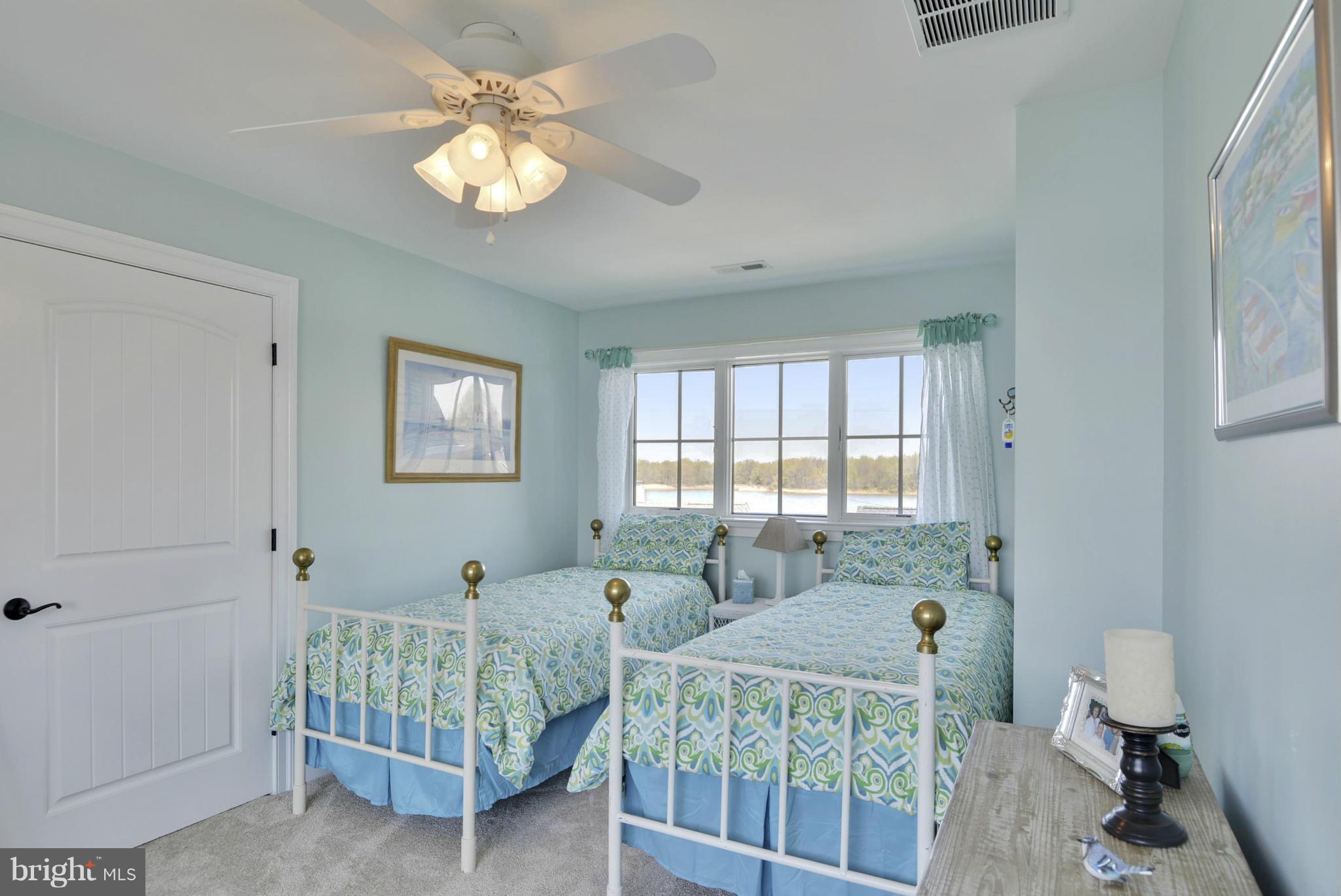 1824 Wilson Point Road Baltimore, MD 21220 - Photo 23 of 28 a bedroom with three beds and a window