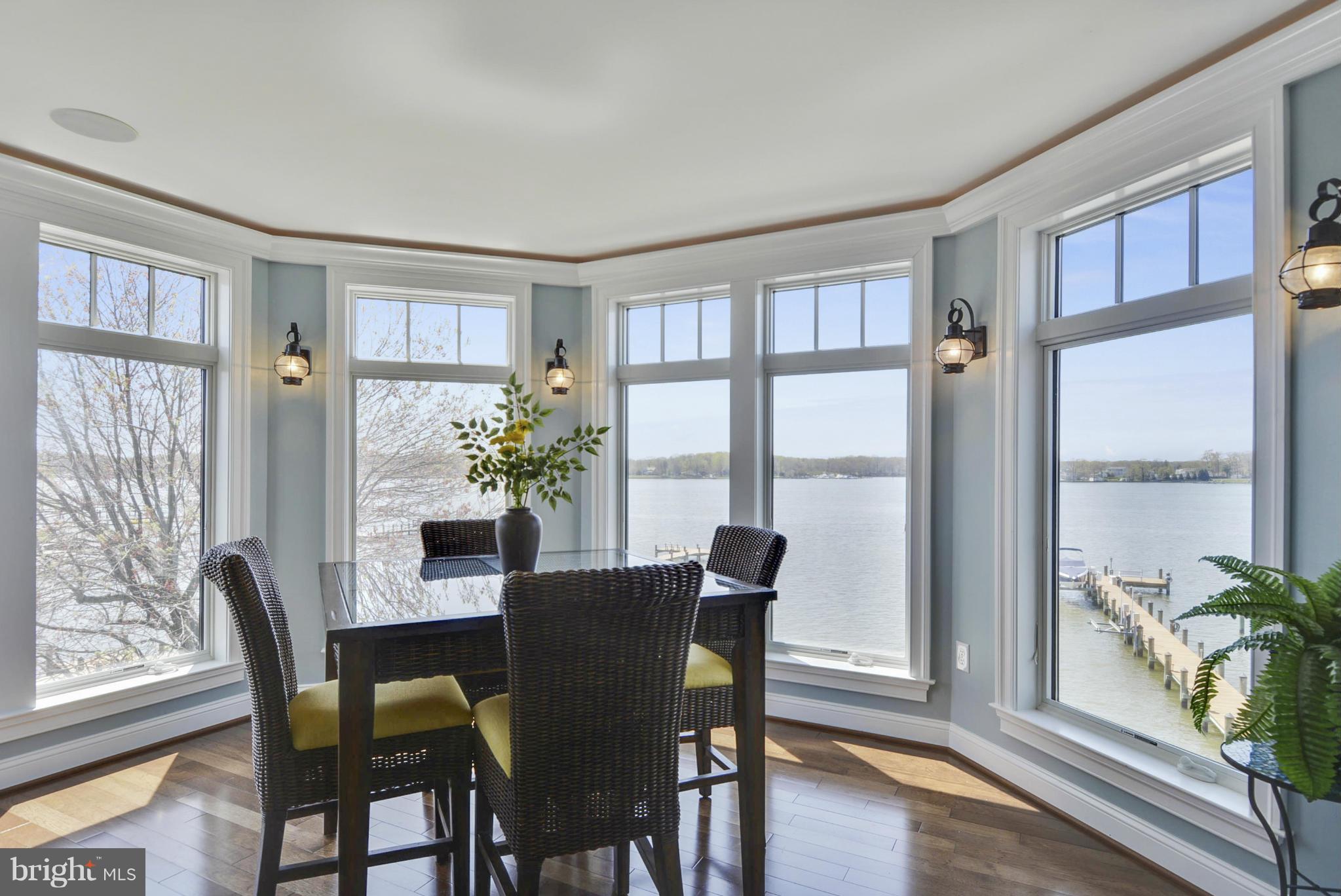1824 Wilson Point Road Baltimore, MD 21220 - Photo 26 of 28 a view of a dining room with furniture window and wooden floor