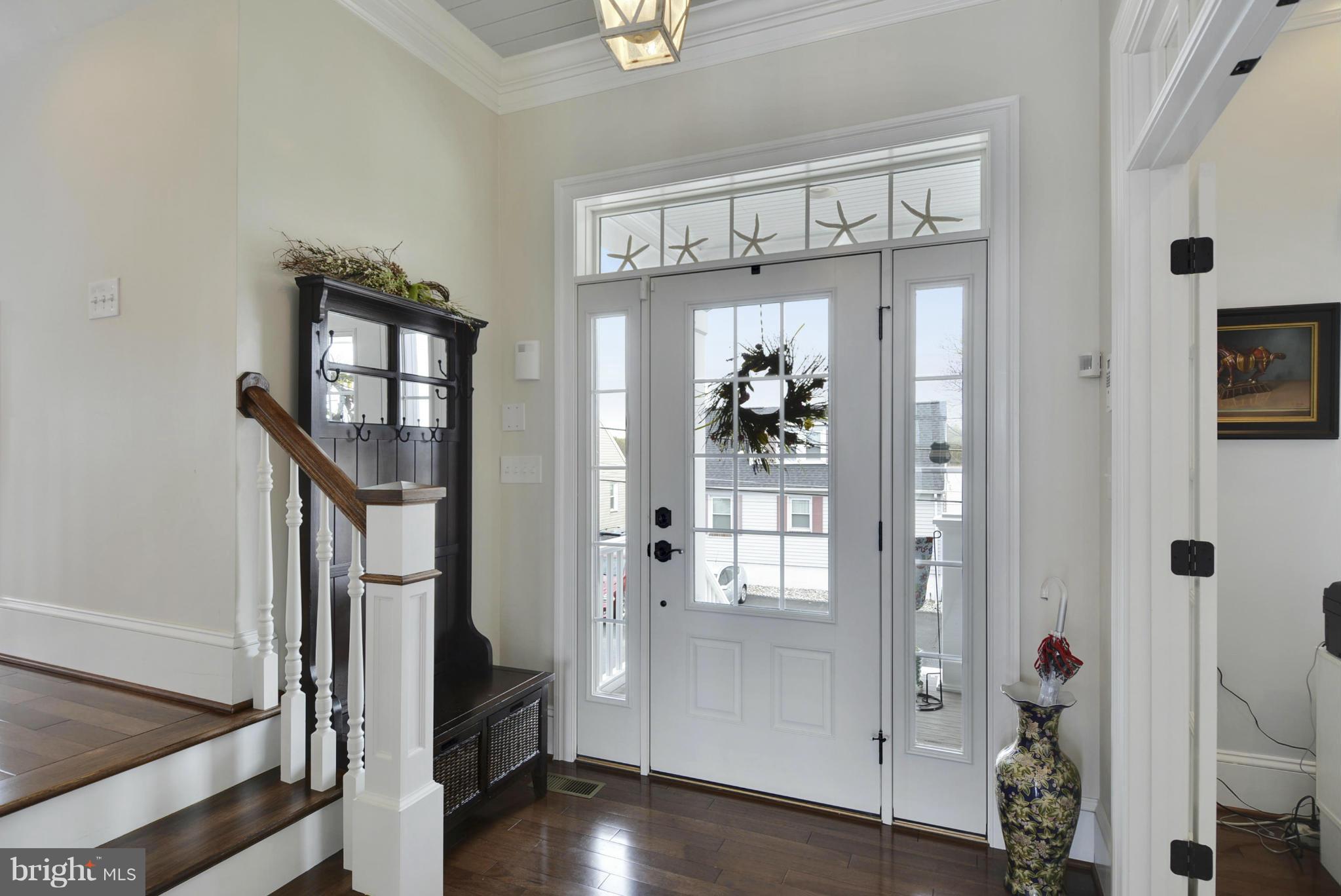 1824 Wilson Point Road Baltimore, MD 21220 - Photo 6 of 28 a view of an entryway with wooden floor and windows