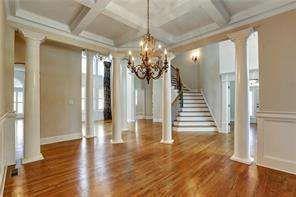 802 Pathview Court Dacula, GA 30019 - Photo 11 of 56 a view of a hallway with wooden floor and staircase