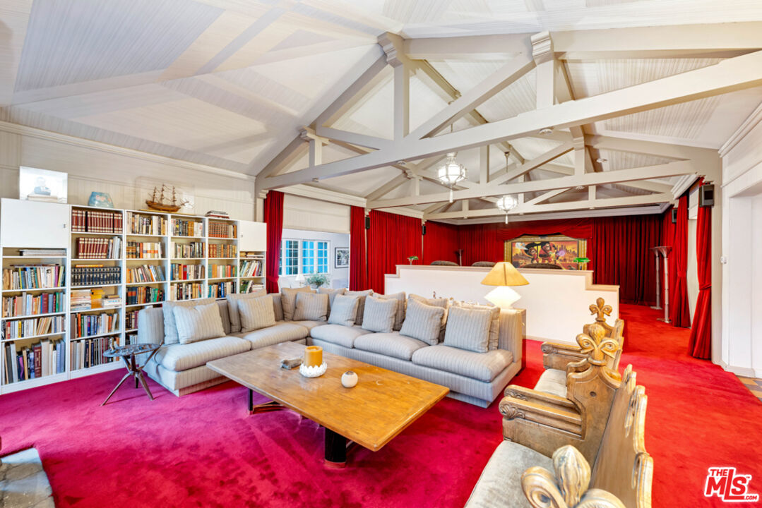 3405 Fryman Road Studio City, CA 91604 - Photo 12 of 28 a living room with furniture a rug and a chandelier