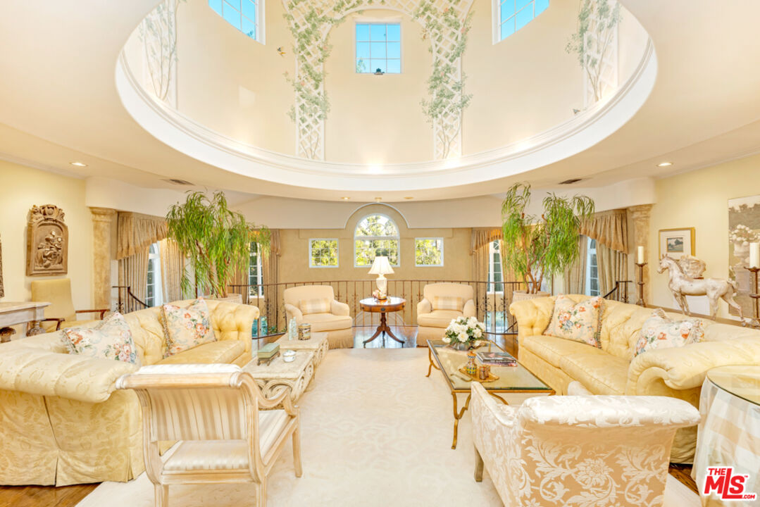 3405 Fryman Road Studio City, CA 91604 - Photo 3 of 28 a living room with furniture and a chandelier