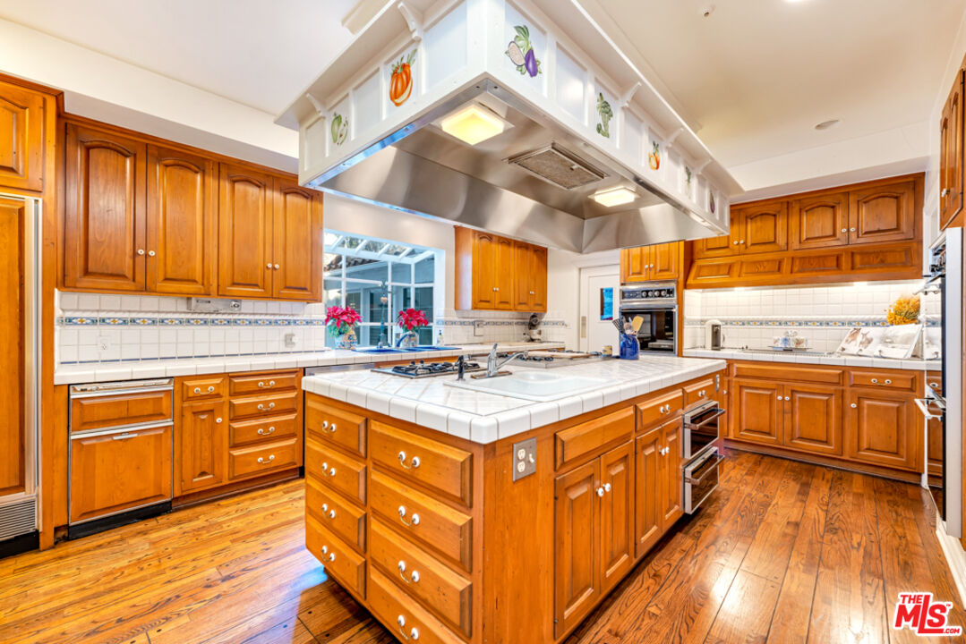 3405 Fryman Road Studio City, CA 91604 - Photo 5 of 28 a kitchen with stainless steel appliances granite countertop a stove and a sink