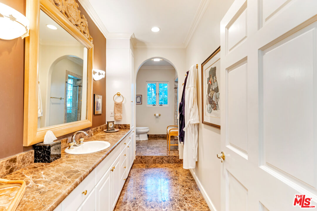 3405 Fryman Road Studio City, CA 91604 - Photo 8 of 28 a bathroom with a granite countertop double vanity sink and a large mirror
