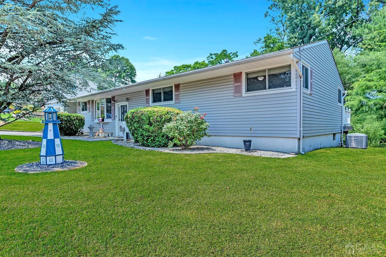 5 Thomas Road East Brunswick, NJ 08816 - Photo 3 of 29 a view of a house with a yard