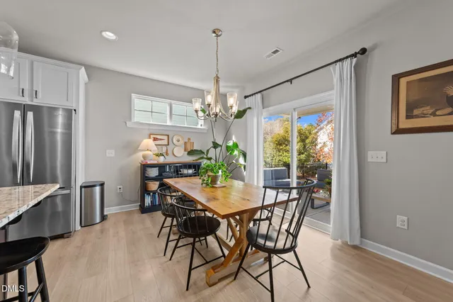 a view of a dining room with furniture and window