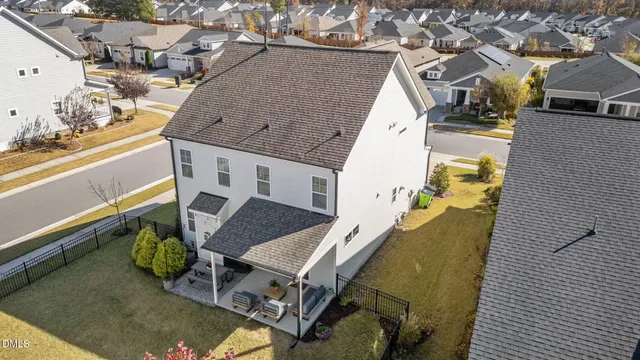 an aerial view of a house with outdoor space