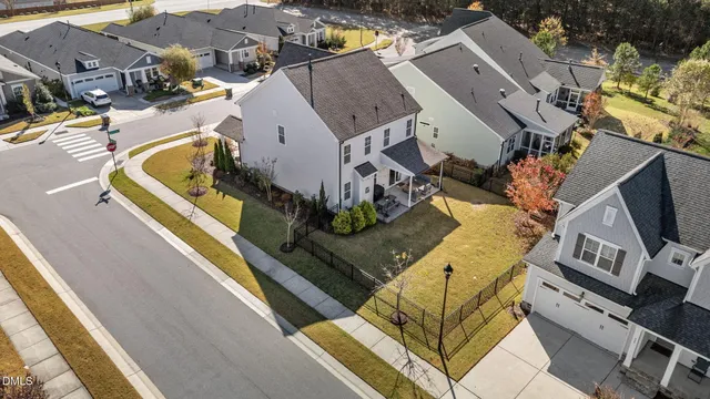 a view of a house with backyard porch and sitting area
