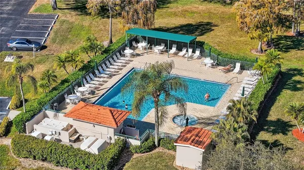 an aerial view of a house with a yard and garden