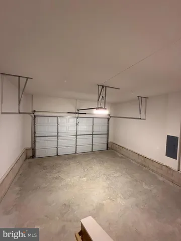 a view of a big yard with table and chairs under an umbrella