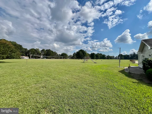 a view of a golf course with a lake