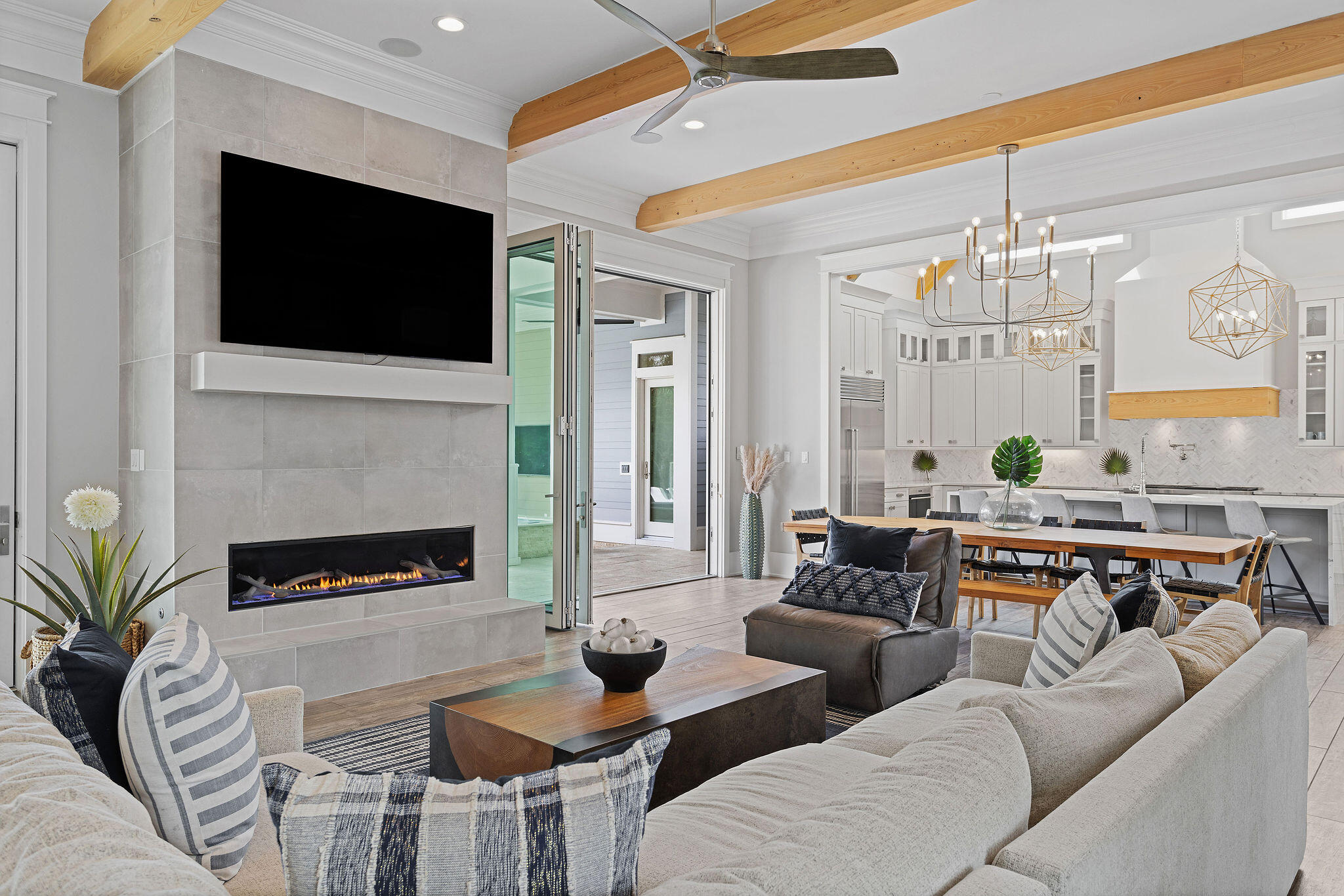 70 Bullard Road Santa Rosa Beach, FL 32459 - Photo 19 of 63 a living room with furniture a flat screen tv and a fireplace