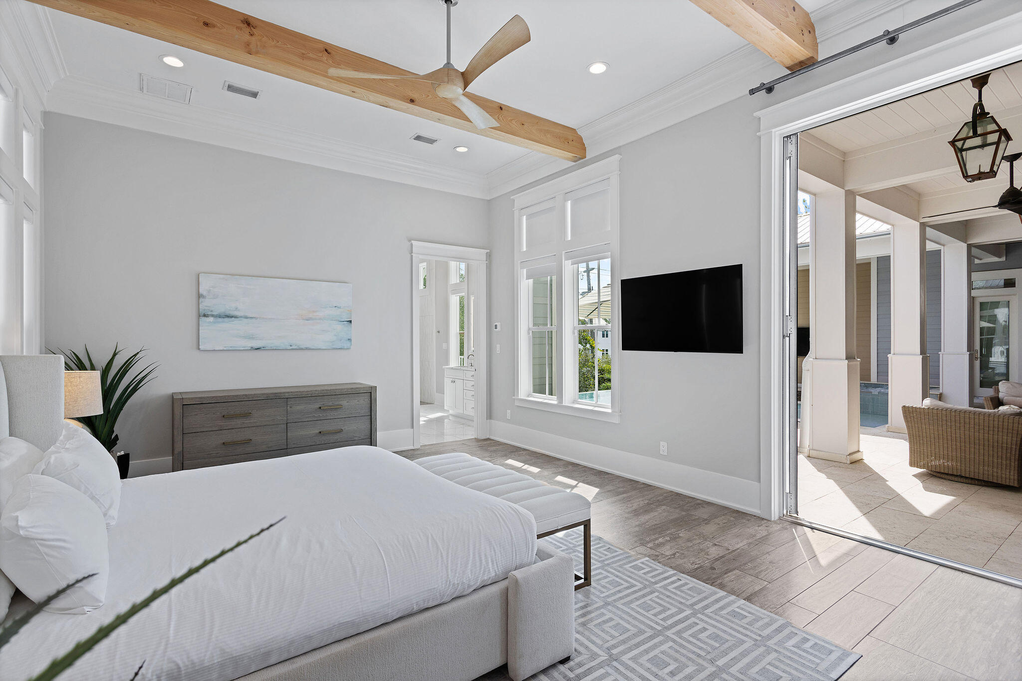 70 Bullard Road Santa Rosa Beach, FL 32459 - Photo 38 of 63 a bedroom with a large bed a flat tv screen and a view of living room