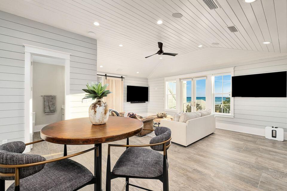 70 Bullard Road Santa Rosa Beach, FL 32459 - Photo 55 of 63 a living room with furniture and a flat screen tv