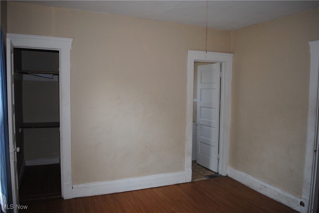841 Whitcomb Road Cleveland, OH 44110 - Photo 25 of 30 Unfurnished bedroom with wood finished floors and baseboards