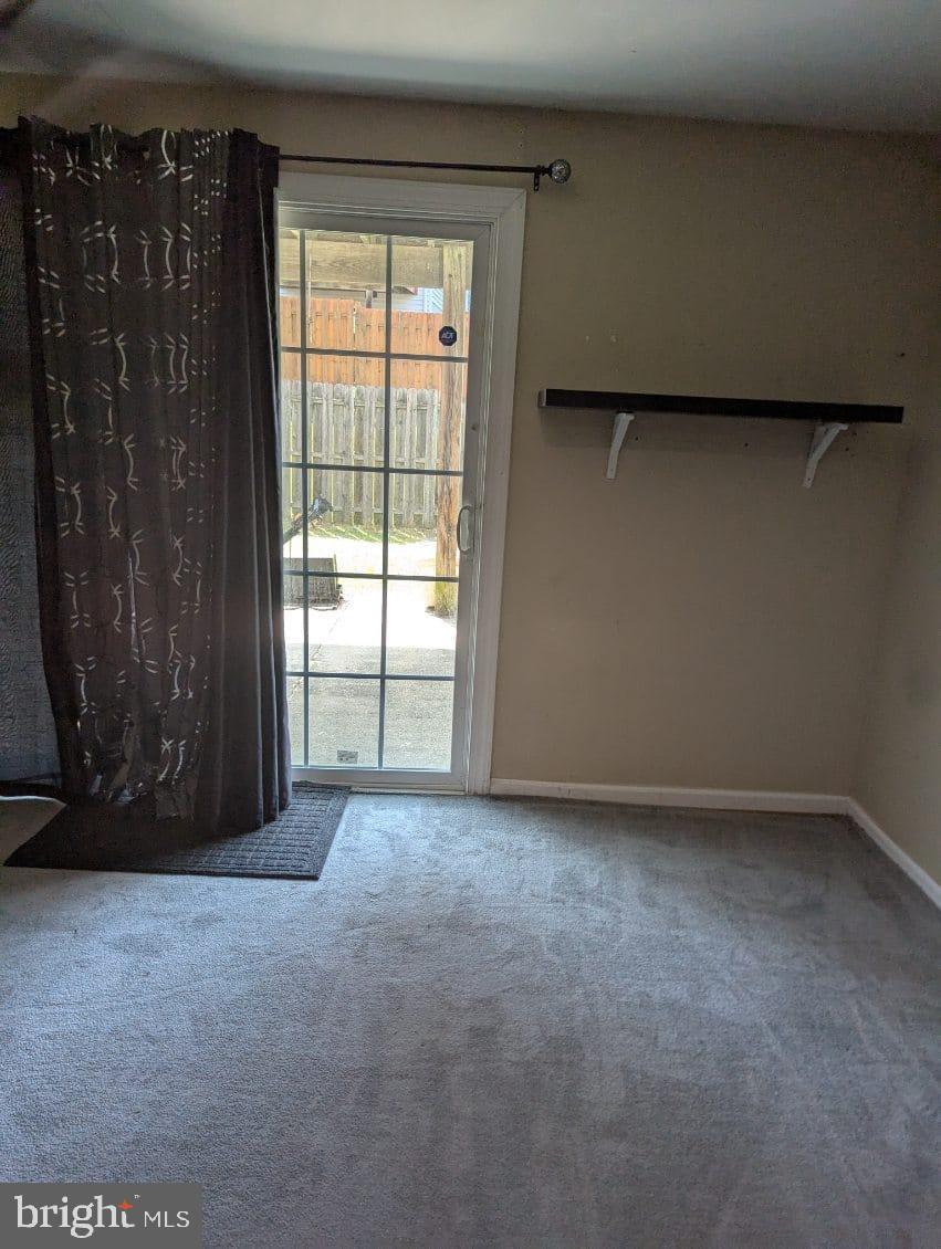 6945 Rockfield Road Baltimore, MD 21244 - Photo 3 of 10 a view of an empty room with a window