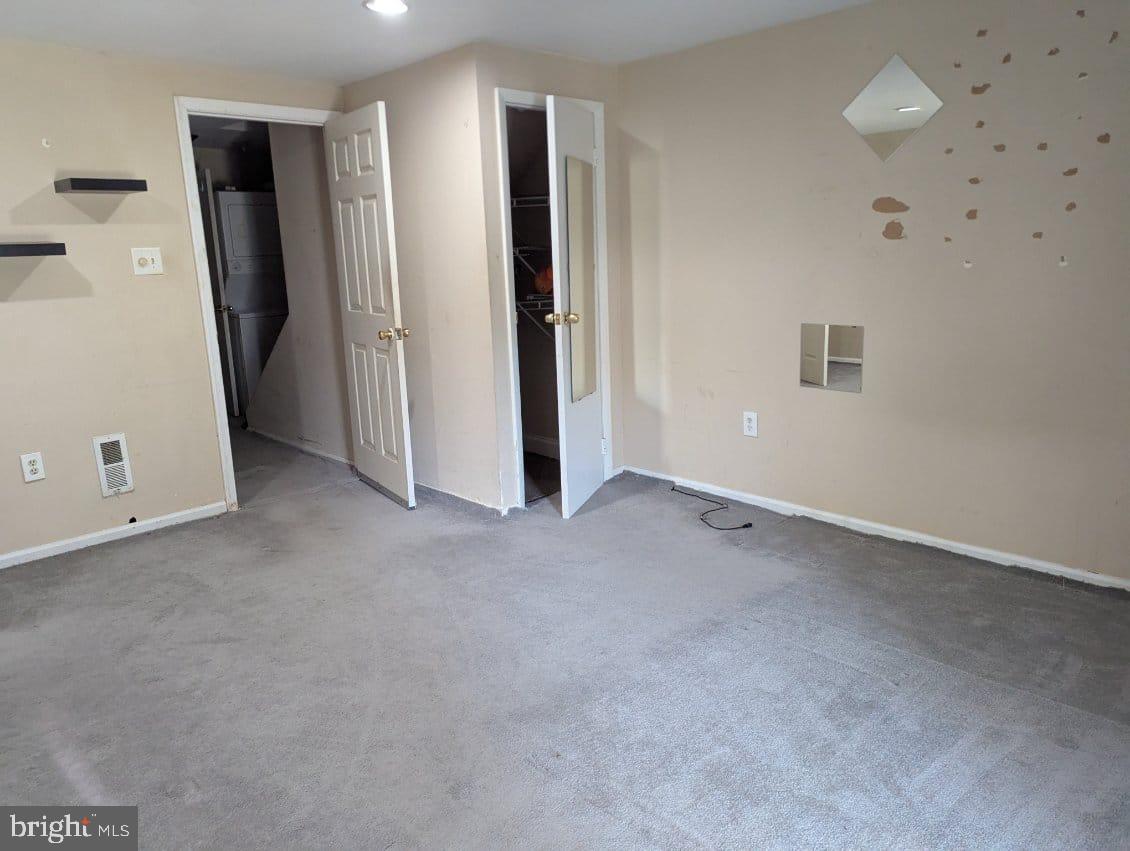 6945 Rockfield Road Baltimore, MD 21244 - Photo 4 of 10 an empty room with closet and utility room