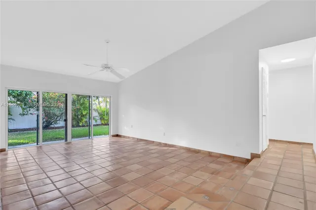 a view of an empty room with windows