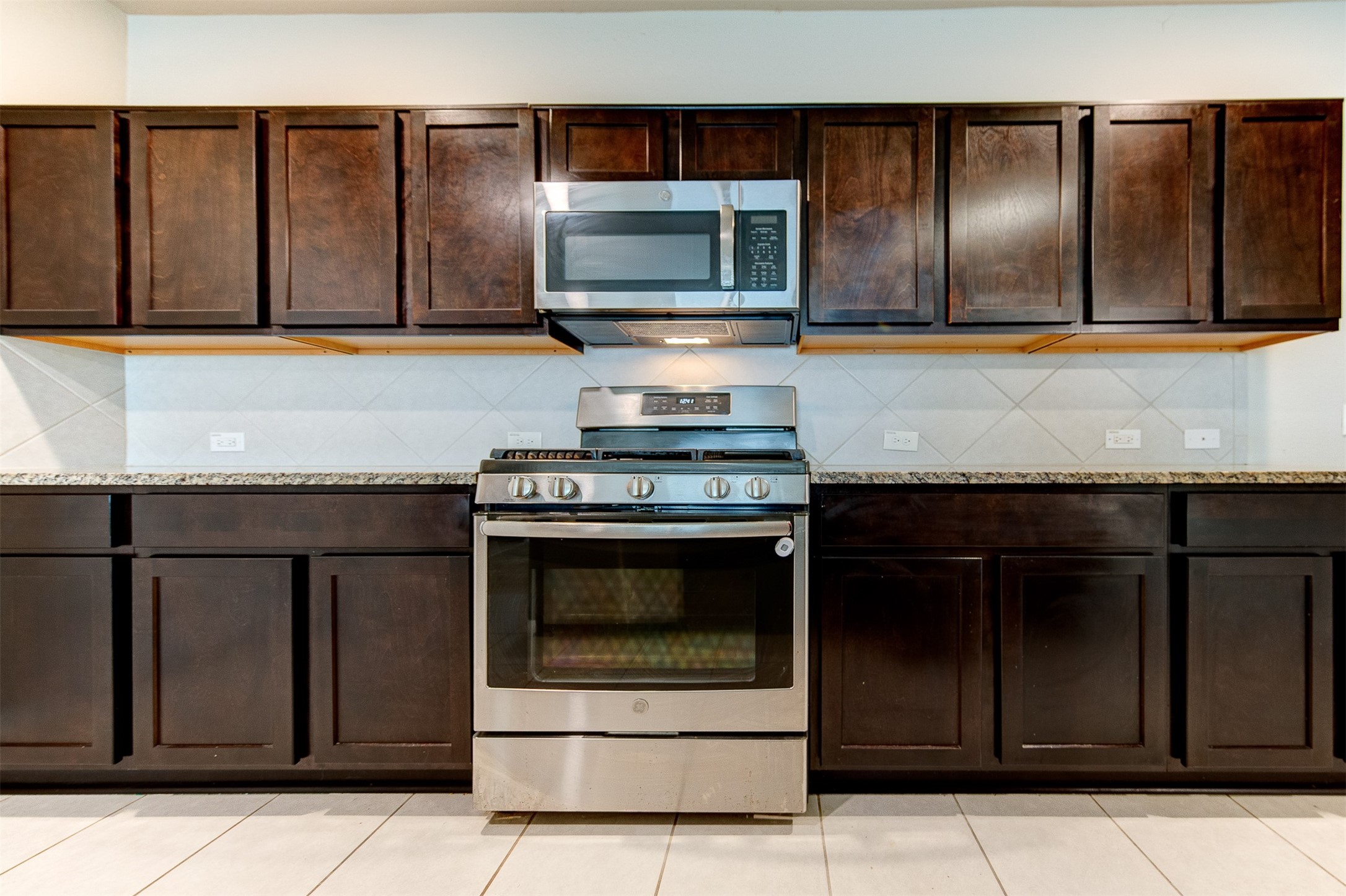 2164 Dale Street Alvin, TX 77511 - Photo 13 of 35 a kitchen with granite countertop stainless steel appliances and cabinets