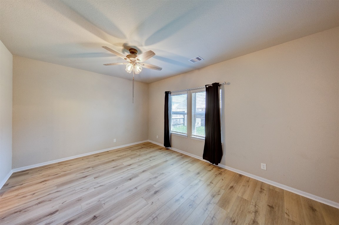 2164 Dale Street Alvin, TX 77511 - Photo 15 of 35 wooden floor in an empty room with a window
