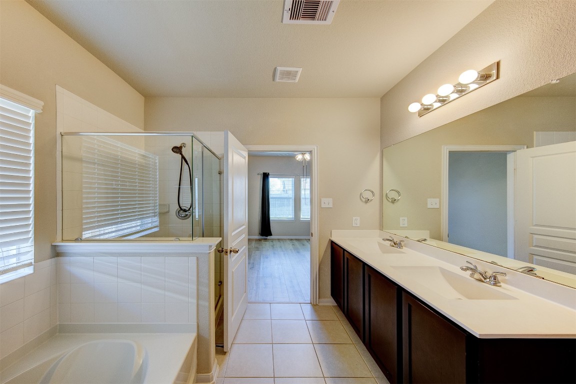 2164 Dale Street Alvin, TX 77511 - Photo 19 of 35 a bathroom with a double vanity sink and a mirror