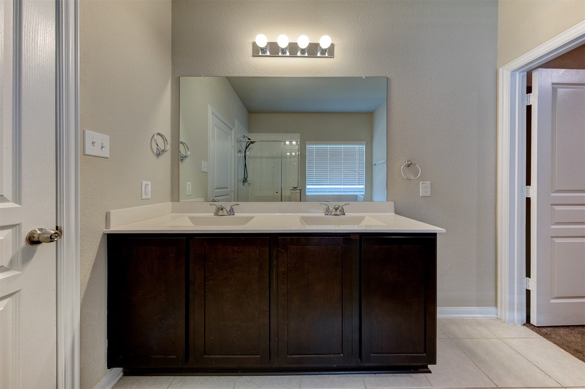 2164 Dale Street Alvin, TX 77511 - Photo 20 of 35 a bathroom with a sink and a mirror