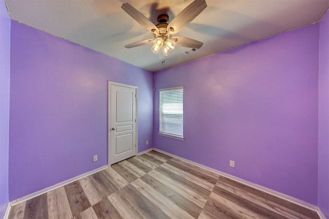 2164 Dale Street Alvin, TX 77511 - Photo 23 of 35 a view of a livingroom with a chandelier fan and a large window