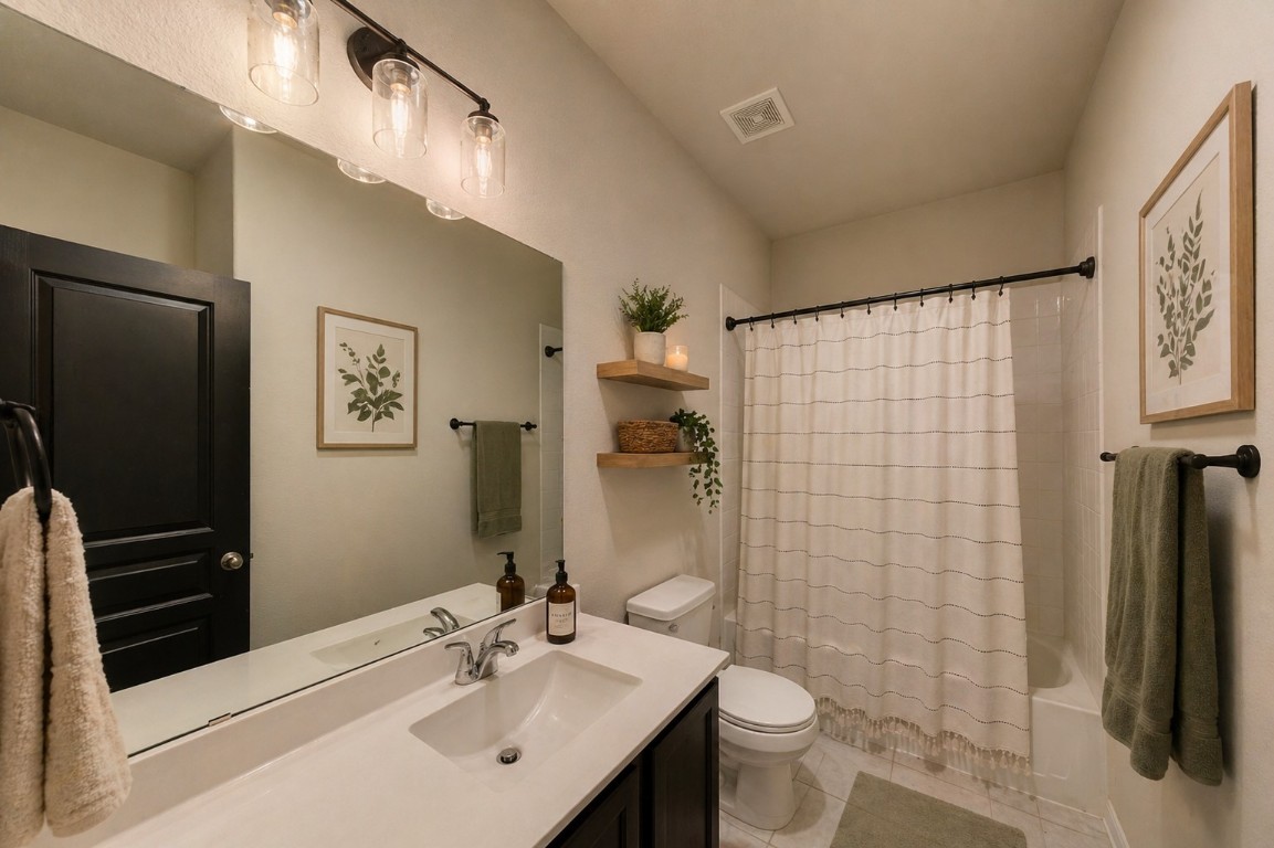2164 Dale Street Alvin, TX 77511 - Photo 25 of 35 a bathroom with a sink a toilet and shower