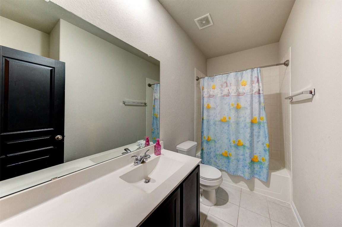 2164 Dale Street Alvin, TX 77511 - Photo 26 of 35 a bathroom with a sink toilet and shower