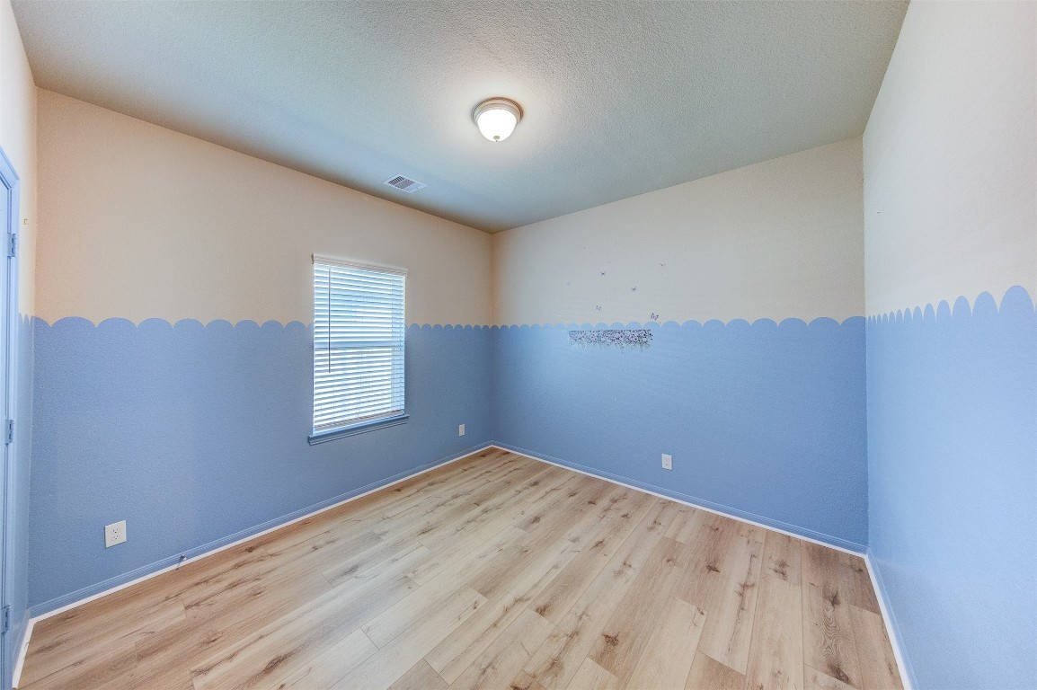 2164 Dale Street Alvin, TX 77511 - Photo 27 of 35 a view of empty room with wooden floor