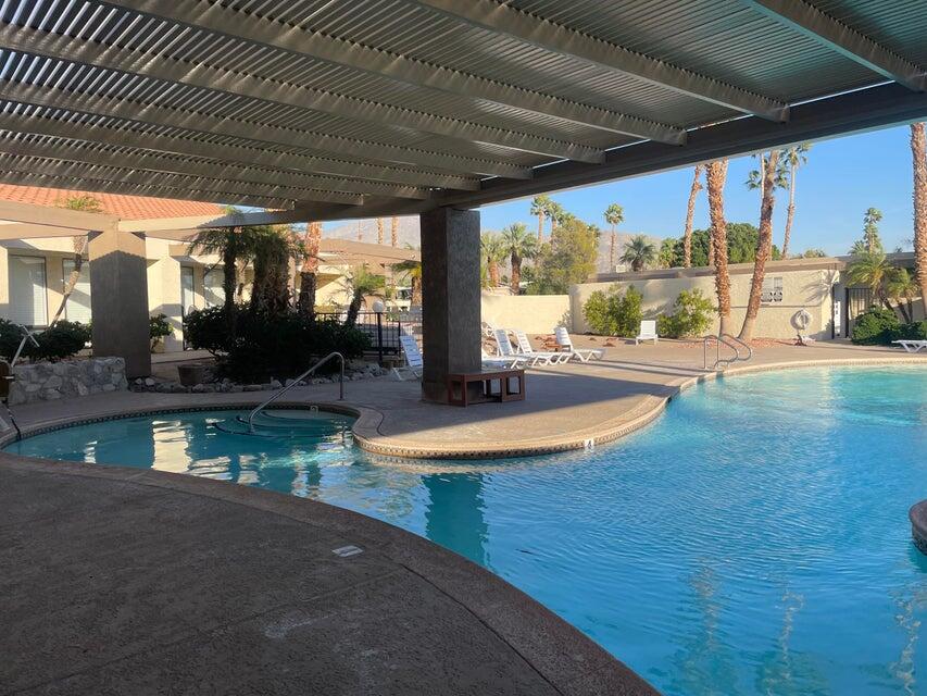 74711 Dillon Road, Unit 819 Desert Hot Springs, CA 92241 - Photo 25 of 41 a view of a swimming pool with a patio