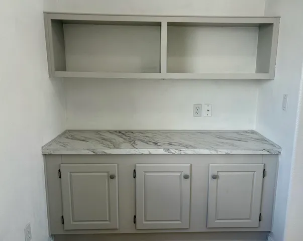 a utility room with cabinets