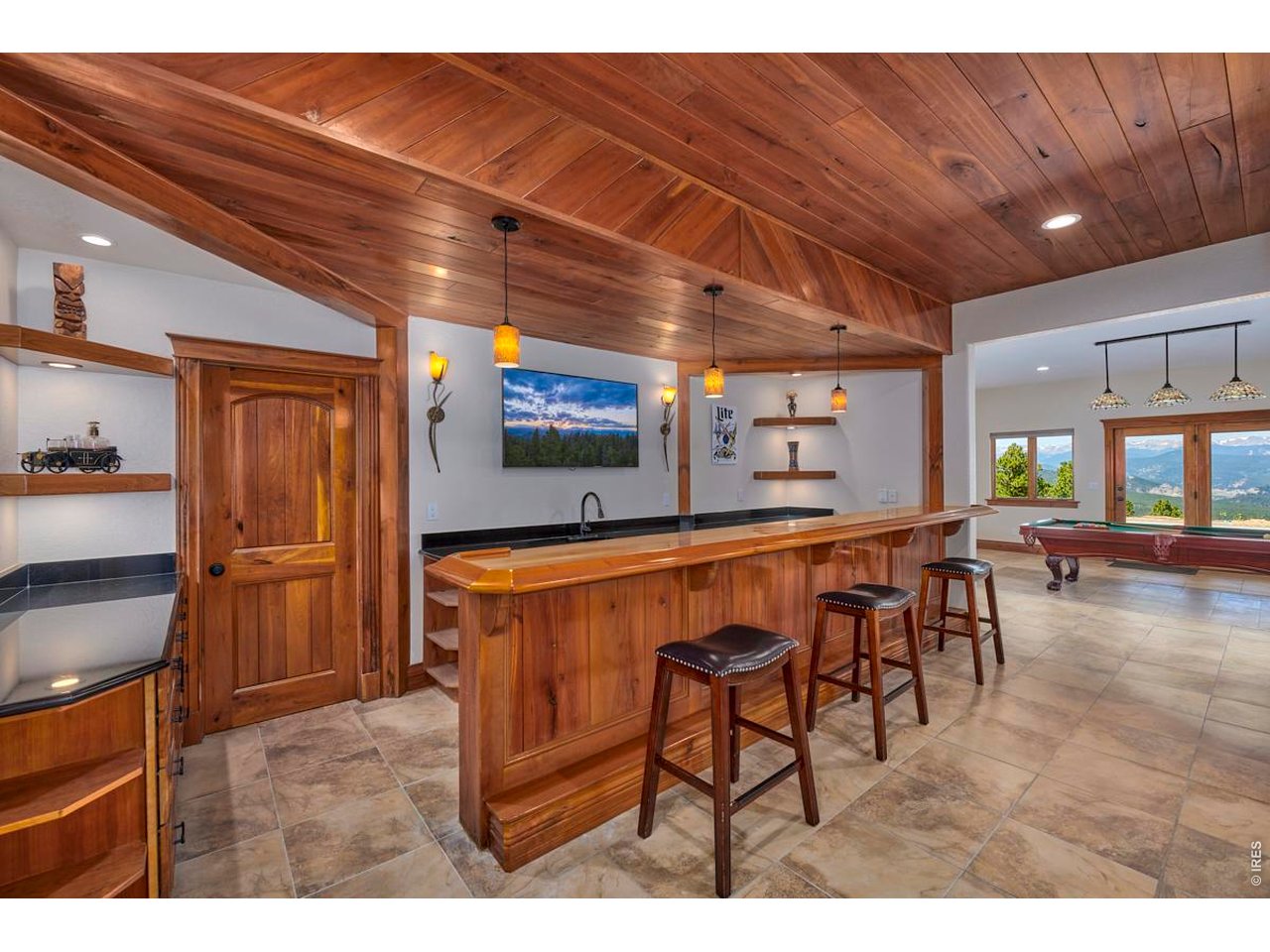 200 Kimwood Road Black Hawk, CO 80422 - Photo 19 of 44 Lower-level bar with sink, dishwasher and dedicated wine room